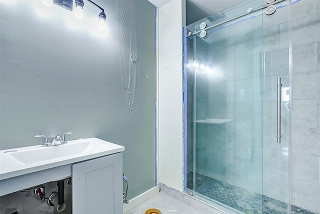 bathroom featuring vanity and an enclosed shower