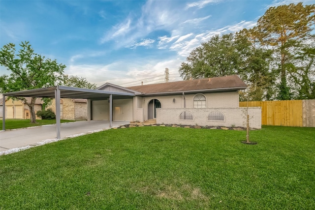 ranch-style house featuring a front yard and a carport