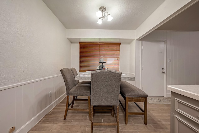 dining area with a textured ceiling