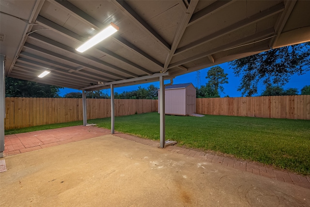 view of patio with a storage unit