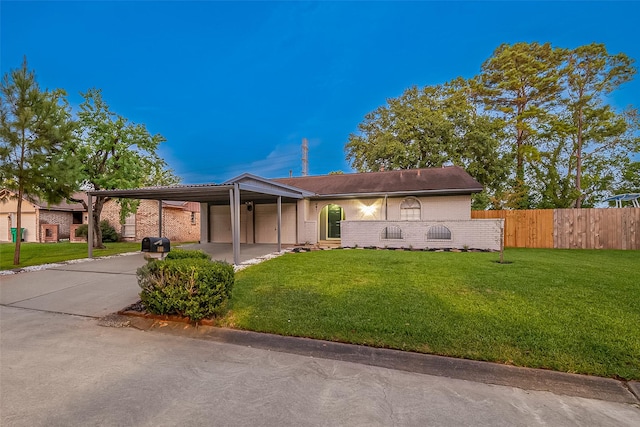 ranch-style home with a carport and a front yard