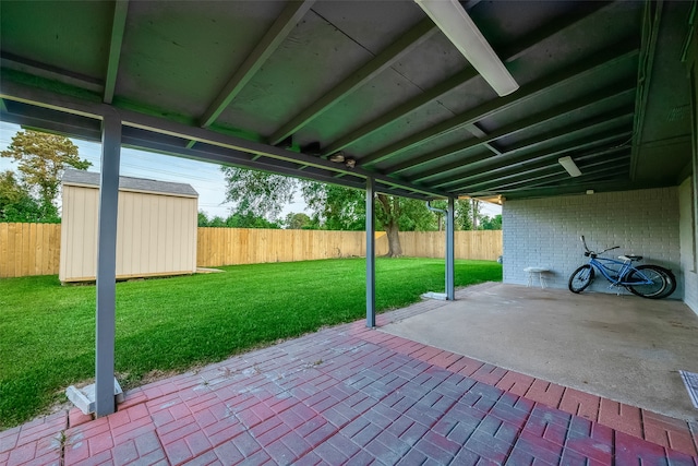 view of patio / terrace with a shed