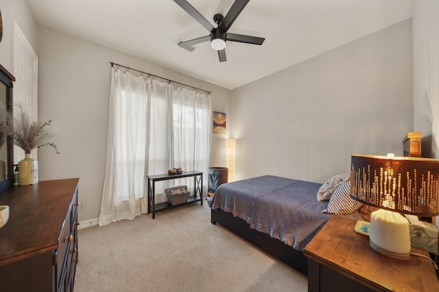 bedroom featuring ceiling fan, light carpet, and lofted ceiling