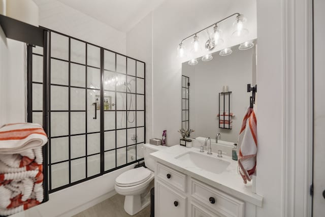 full bathroom with tile patterned flooring, toilet, tiled shower / bath combo, and vanity