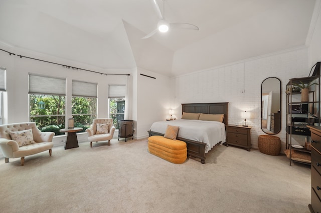 carpeted bedroom with high vaulted ceiling, ceiling fan, and ornamental molding