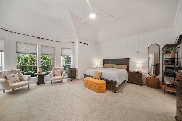 bedroom with ceiling fan, high vaulted ceiling, brick wall, and light colored carpet