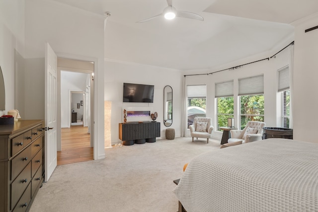 carpeted bedroom with ceiling fan, crown molding, and multiple windows