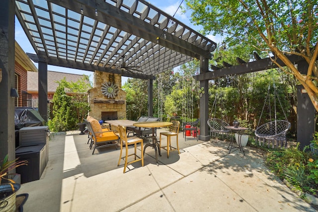 view of patio with outdoor dining space, an outdoor stone fireplace, and a pergola