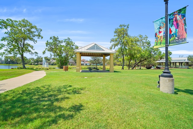 view of property's community with a gazebo and a yard