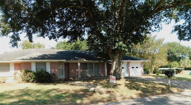 1400 Allyne Ln, Brenham, TX 77833 - ranch-style home with driveway, brick siding, and a garage