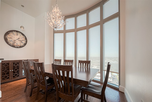 dining room featuring an inviting chandelier and dark hardwood / wood-style floors