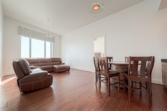 dining space with dark wood-type flooring