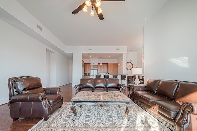 living room with hardwood / wood-style flooring and ceiling fan