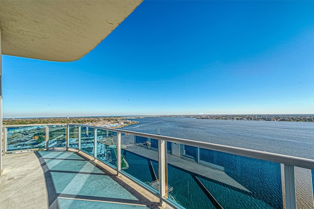 balcony featuring a water view