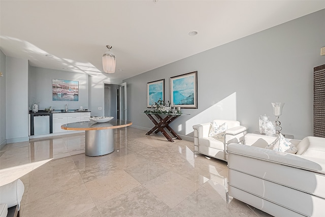 tiled living room featuring sink