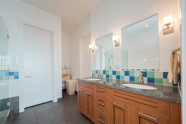 bathroom with backsplash, vanity, tile patterned flooring, an enclosed shower, and toilet