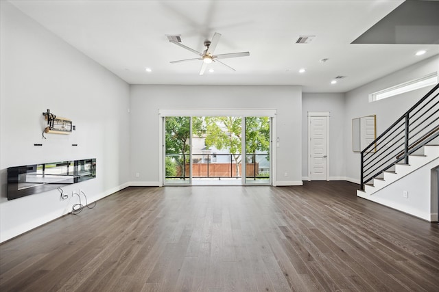 unfurnished living room featuring ceiling fan and wood-type flooring