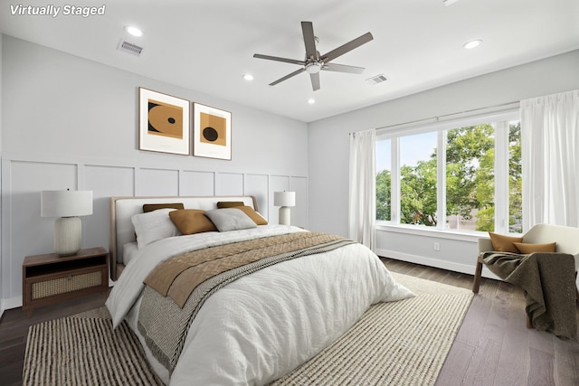 bedroom with ceiling fan and wood-type flooring