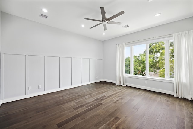 unfurnished room with ceiling fan and hardwood / wood-style flooring