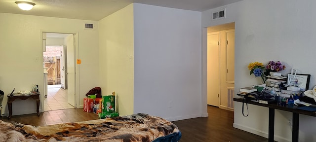 bedroom featuring wood-type flooring