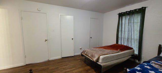 bedroom with wood-type flooring