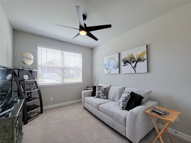 carpeted living room featuring ceiling fan