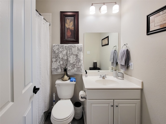 bathroom with a shower with shower curtain, toilet, and vanity