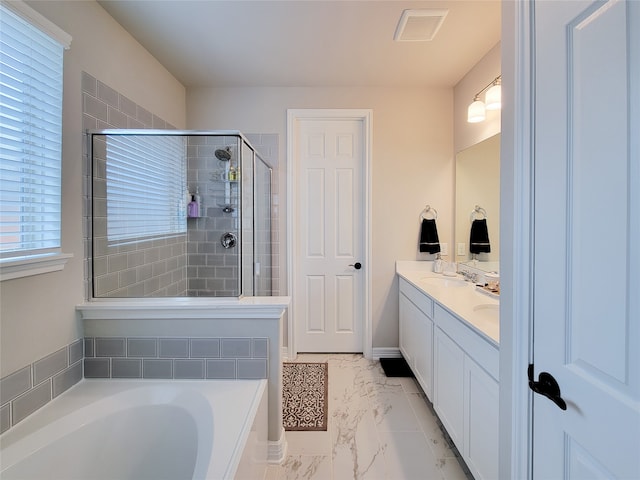 bathroom featuring tile patterned flooring, separate shower and tub, and vanity