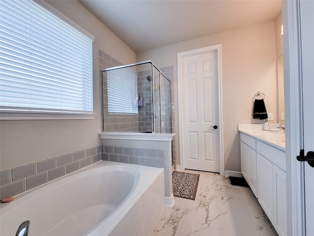 bathroom with tile patterned flooring, separate shower and tub, and vanity