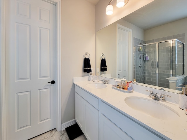 bathroom with tile patterned flooring, a shower with door, and vanity