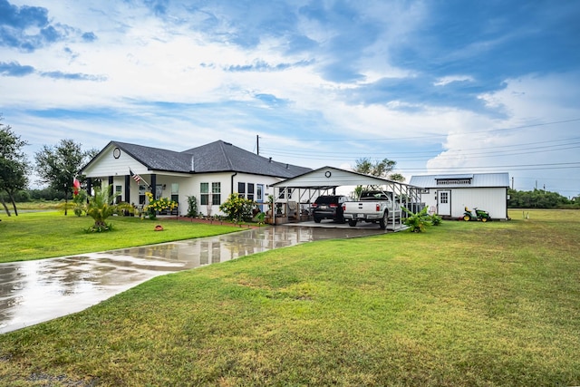 exterior space with a detached carport and a front lawn