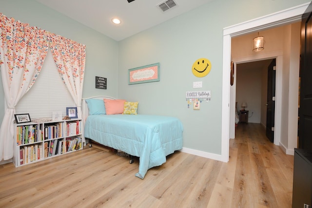 bedroom featuring recessed lighting, wood finished floors, visible vents, and baseboards