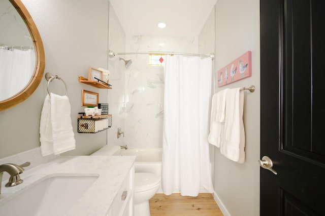 full bath featuring shower / bathtub combination with curtain, vanity, toilet, and wood finished floors