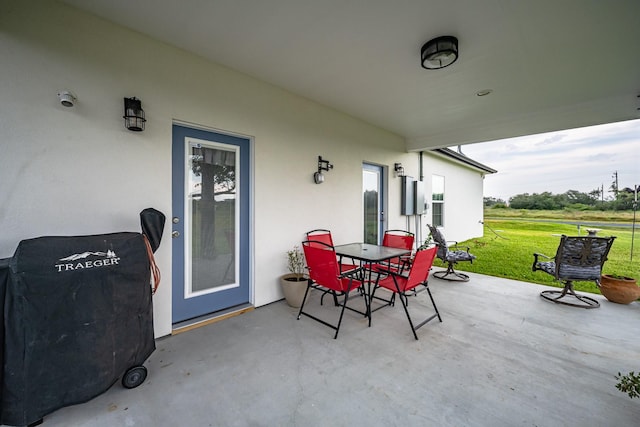 view of patio featuring grilling area and outdoor dining space