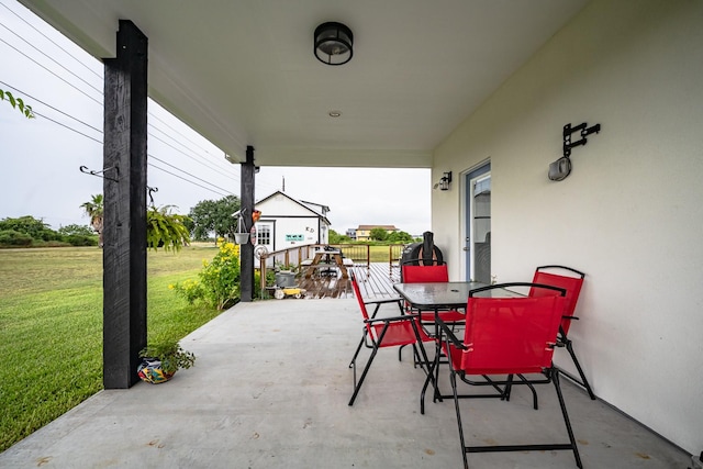 view of patio featuring outdoor dining area