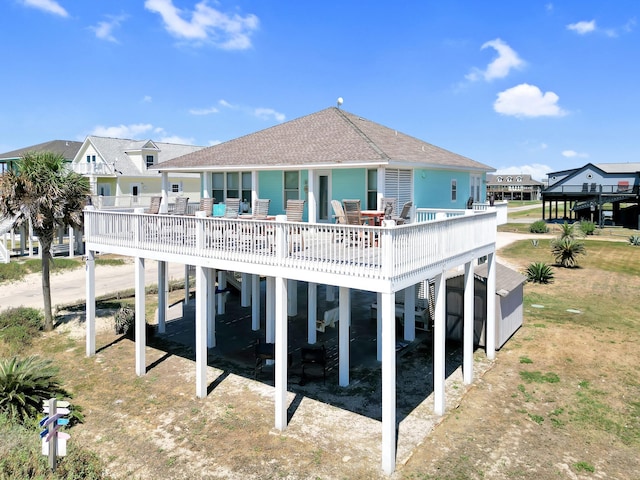 back of house with a carport