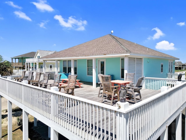 back of house with a wooden deck