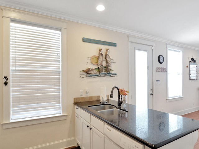 kitchen with white cabinets, white dishwasher, sink, kitchen peninsula, and crown molding