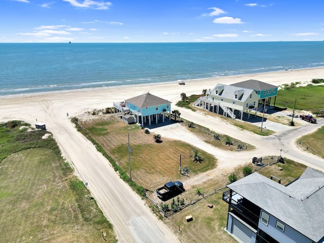 drone / aerial view featuring a view of the beach and a water view