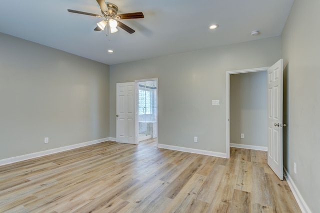 interior space featuring light wood-type flooring, baseboards, a ceiling fan, and recessed lighting