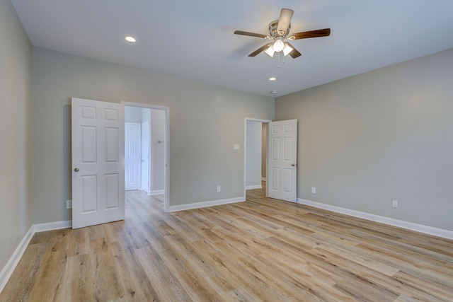 unfurnished bedroom with light wood-type flooring, ceiling fan, baseboards, and recessed lighting