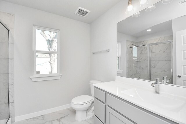 bathroom with vanity, toilet, and a shower with door