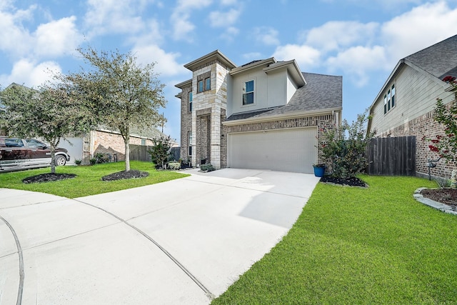 view of front of house featuring a garage and a front yard