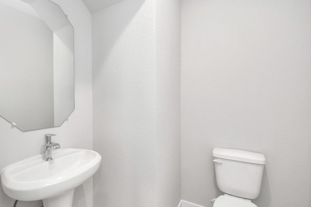 bathroom with sink and toilet