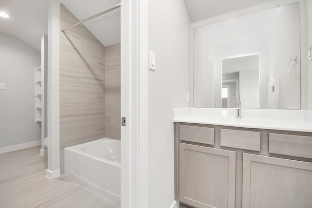 full bathroom with vanity, toilet, and tiled shower / bath