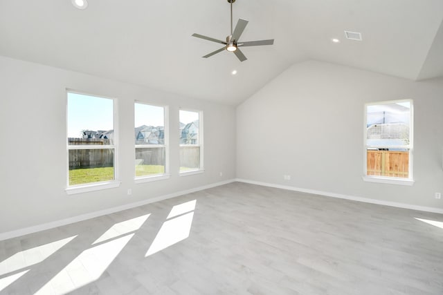 empty room with light hardwood / wood-style flooring, ceiling fan, and lofted ceiling