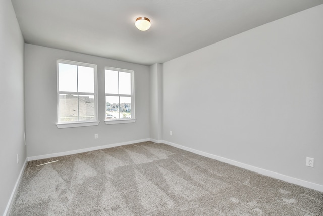 unfurnished room with carpet floors