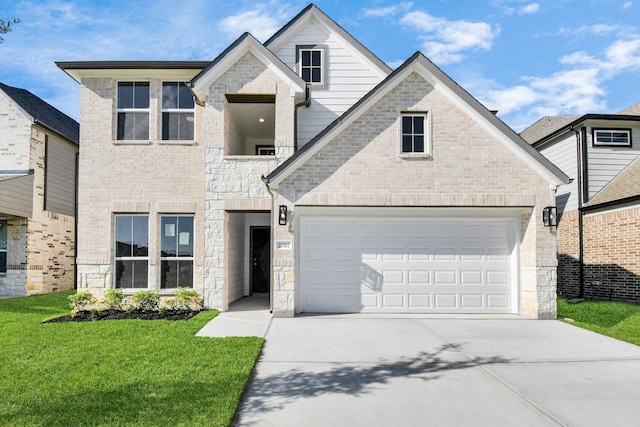 view of front property featuring a front yard and a garage