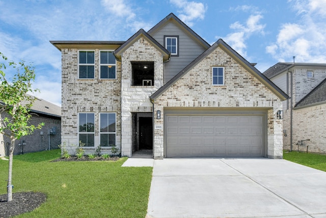 view of front facade featuring a front lawn and a garage