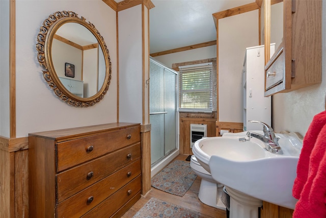 bathroom with toilet and a shower with shower door